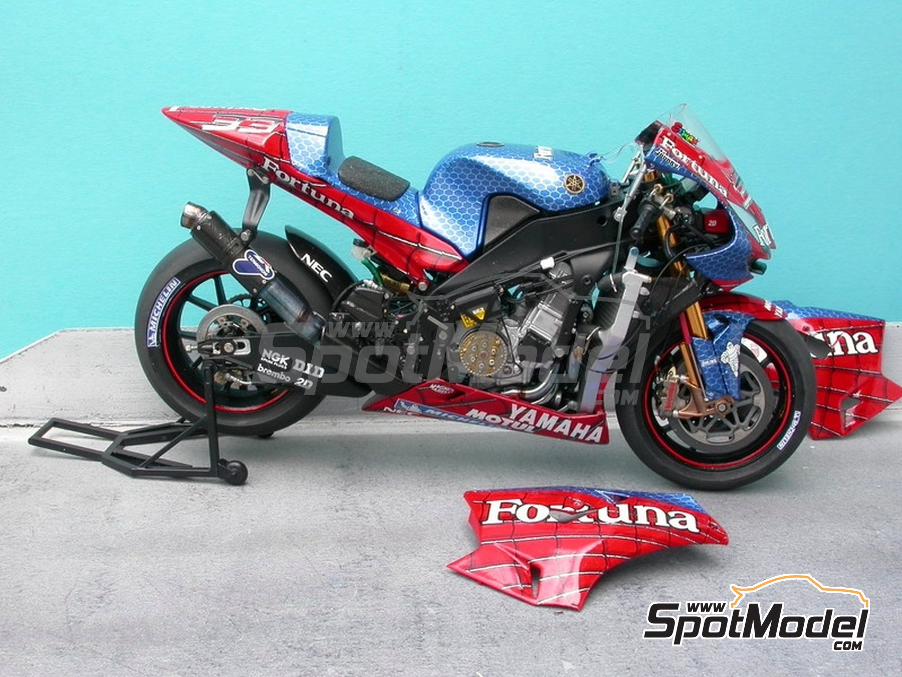 Image 6: Yamaha YZR-M1 Tech 3 Team sponsored by Spiderman Fortuna - Portuguese Moto GP Grand Prix 2004 | Marking / livery in 1/12 scale manufactured by Renaissance Models (ref. MTK12-004A)